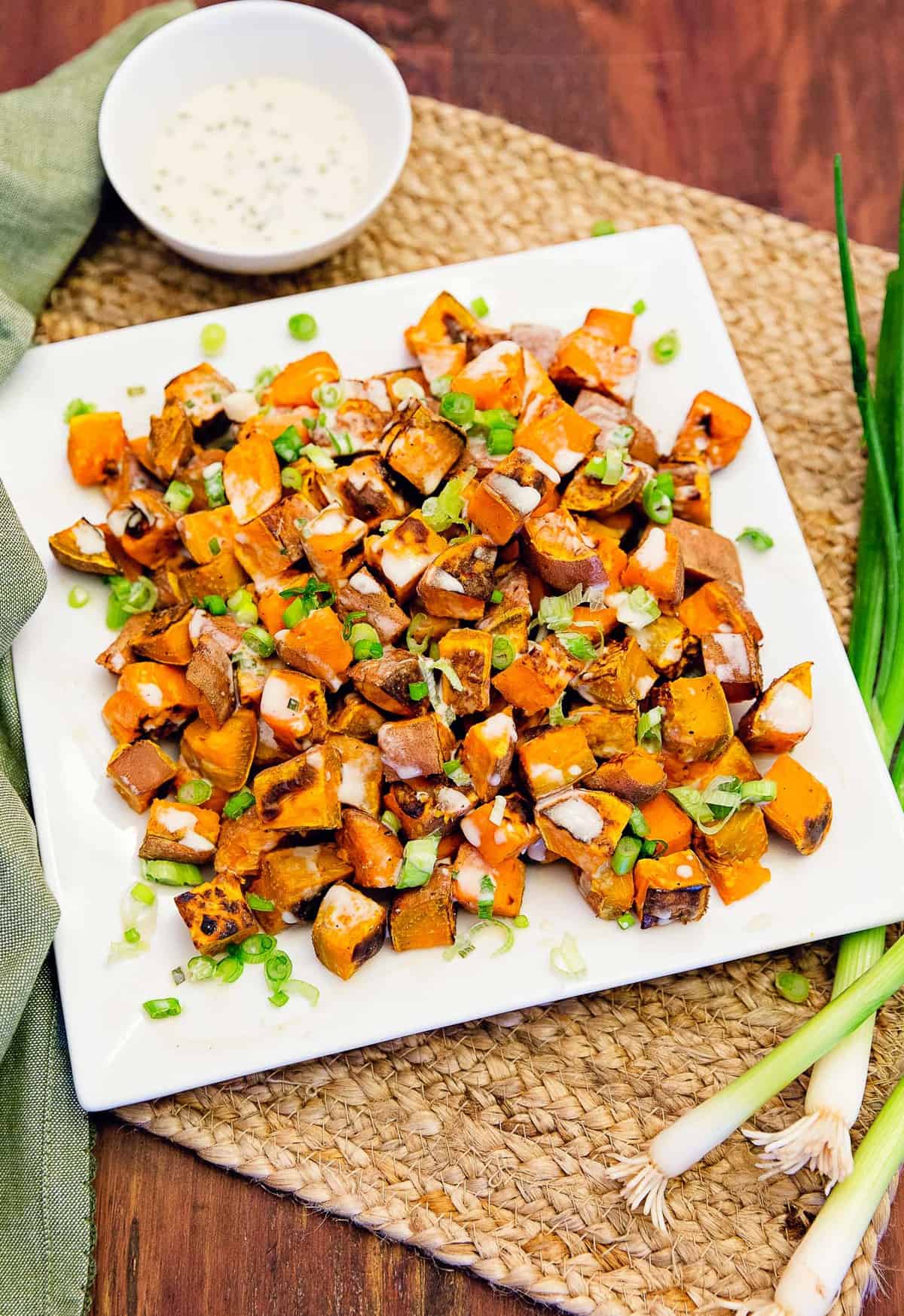 Roast potatoes with green sauce and tahini