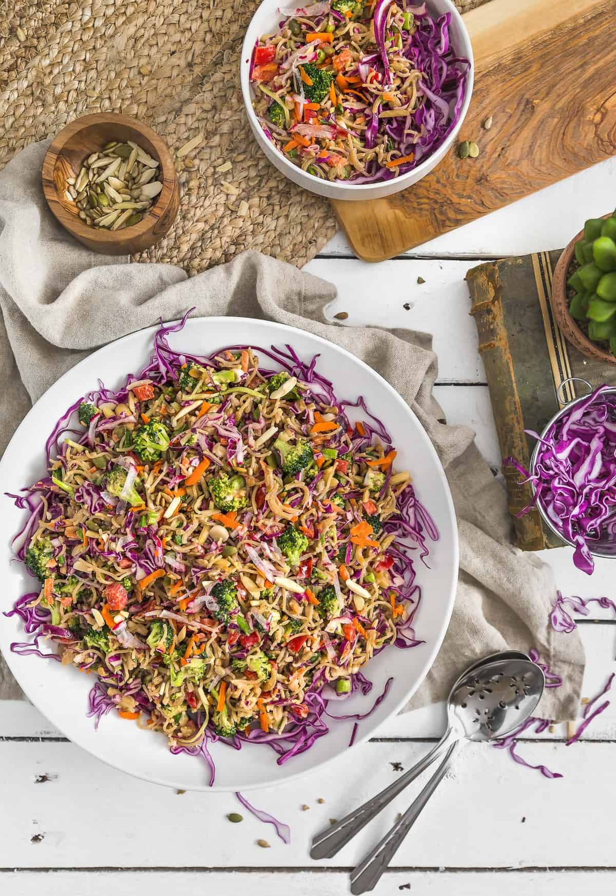 No Oil Broccoli Noodle Slaw, vegan salad, vegan slaw, vegan dinner, broccoli slaw, noodles, vegan noodles, plant based, vegan, vegetarian, whole food plant based, gluten free, recipe, wfpb, healthy, healthy vegan, oil free, no refined sugar, no oil, refined sugar free, dairy free, vegan dressing, vegan lunch, salad, dinner, lunch, easy recipe, dressing, broccoli, summer, picnic, party, entertaining