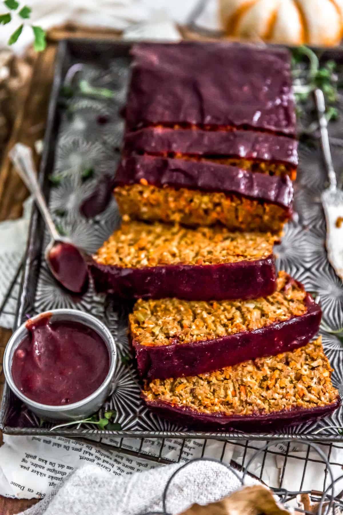 Close up of sliced Harvest Veggie Loaf with spiced cranberry sauce