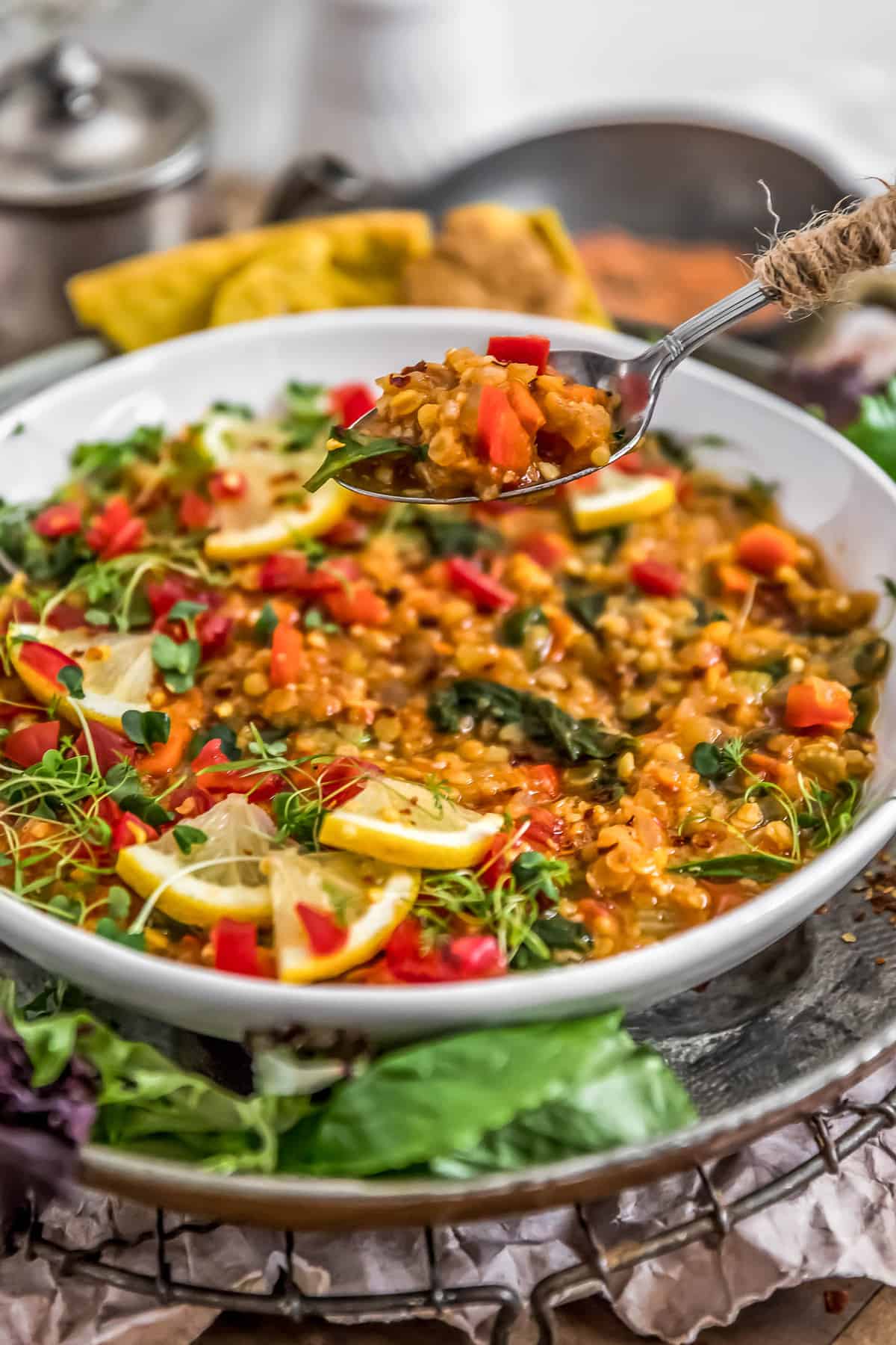 Lemony Red Lentil Spinach Stew with a spoon