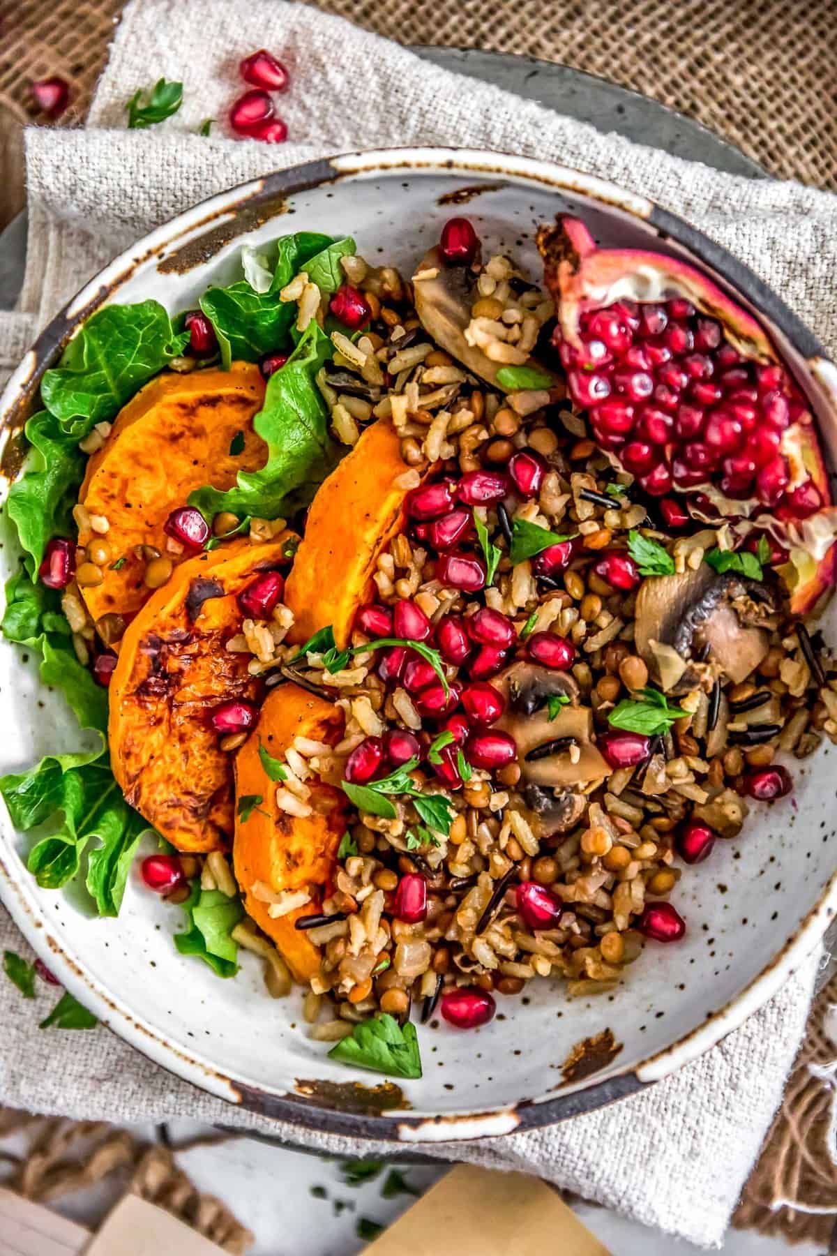 Close up of Lentil Mushroom Wild Rice Pilaf with butternut squash and pomegranate