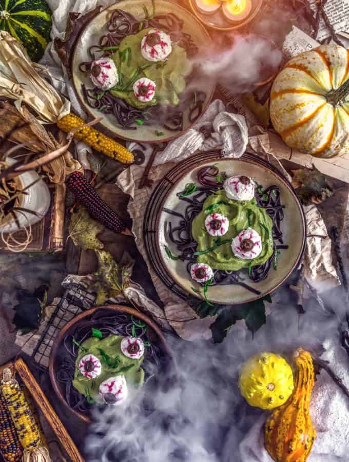 Tablescape of Spooky Spinach Halloween Pasta and smoke