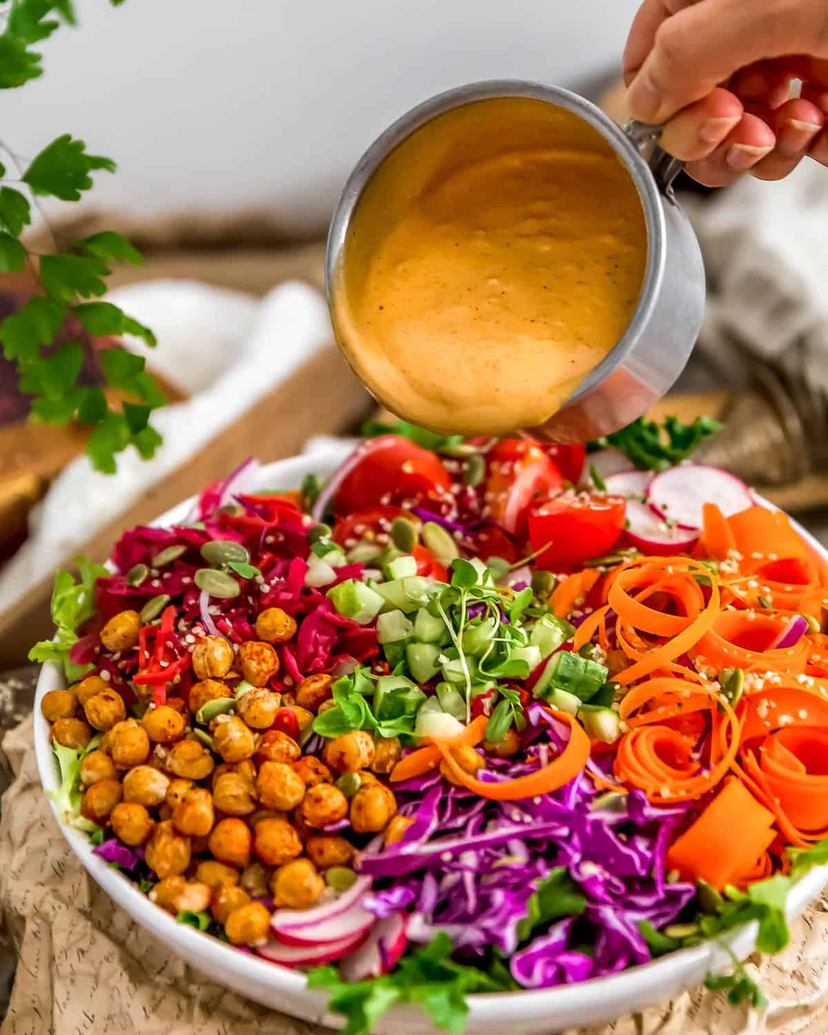 Pouring Oil Free Vegan Thousand Island Dressing