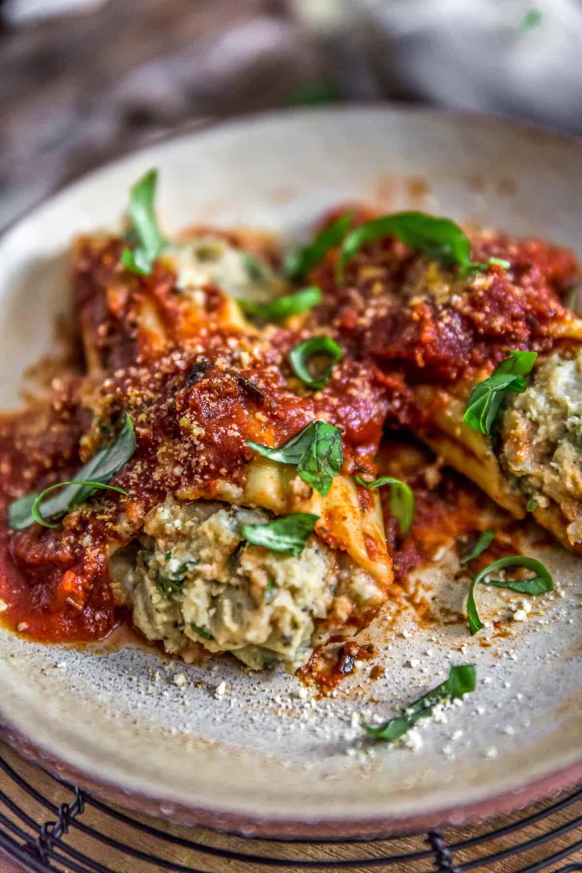 Plated Vegan Manicotti Stuffed with Cauliflower Cream and Spinach