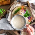 Vegan Tangy Honey Mustard Dressing in a cup