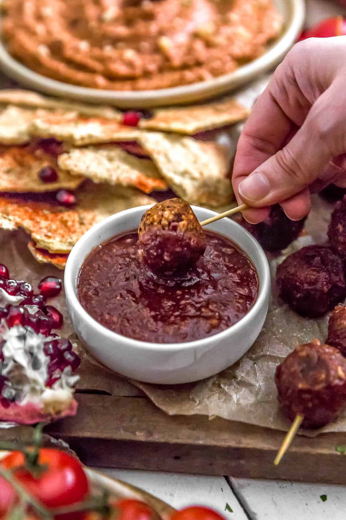 Dipping Vegan Cocktail Meatballs in Healthy Chili Sauce