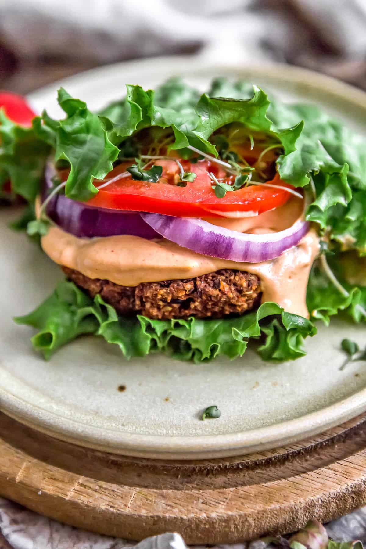 Lettuce wrap of Ultimate Healthy Vegan Black Bean Burger with Special Burger Sauce