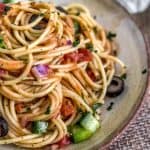 Healthy Italian Spaghetti Salad piled high on a plate