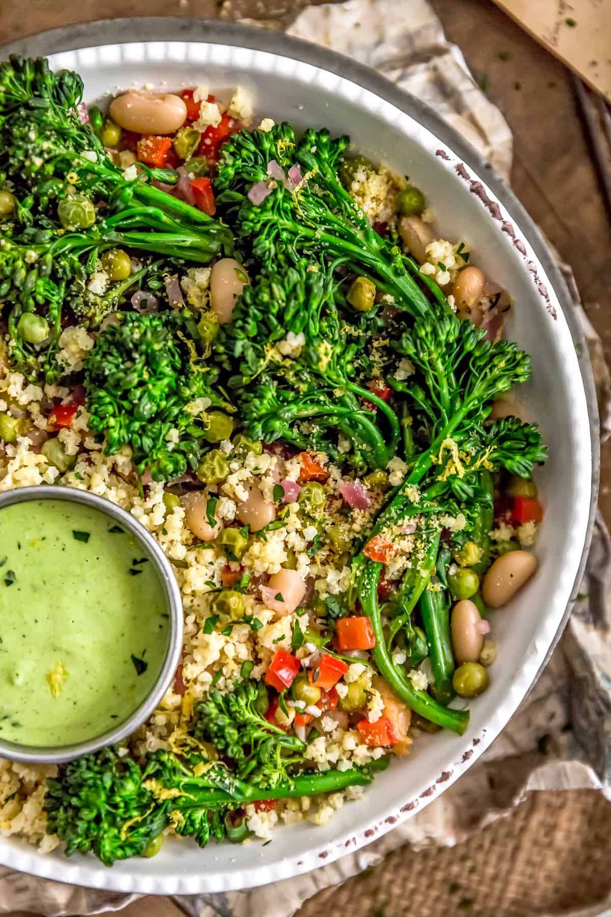 Close up of Italian Broccolini Millet Bowl with Lemony Parsley Sauce