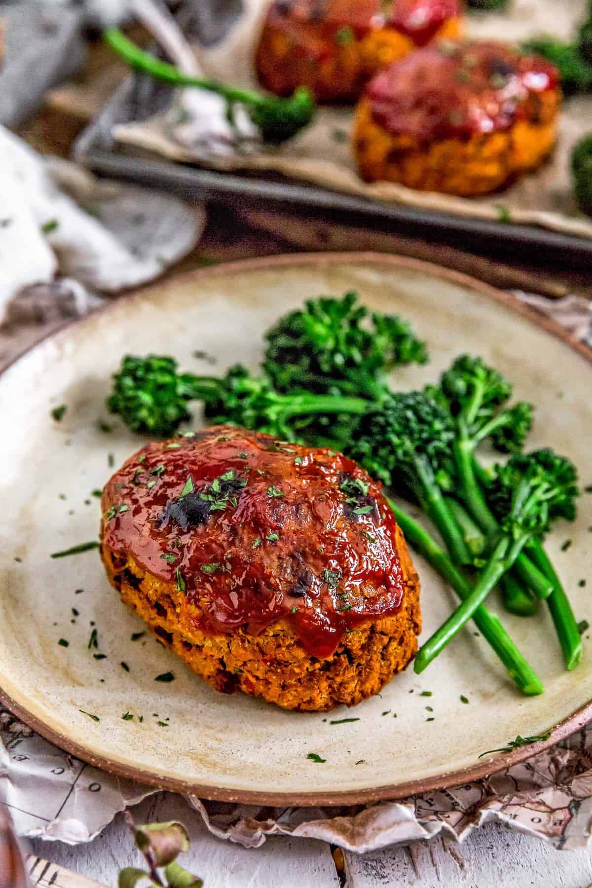 Plate of Mini Roasted Red Pepper Veggie Loaves with broccolini