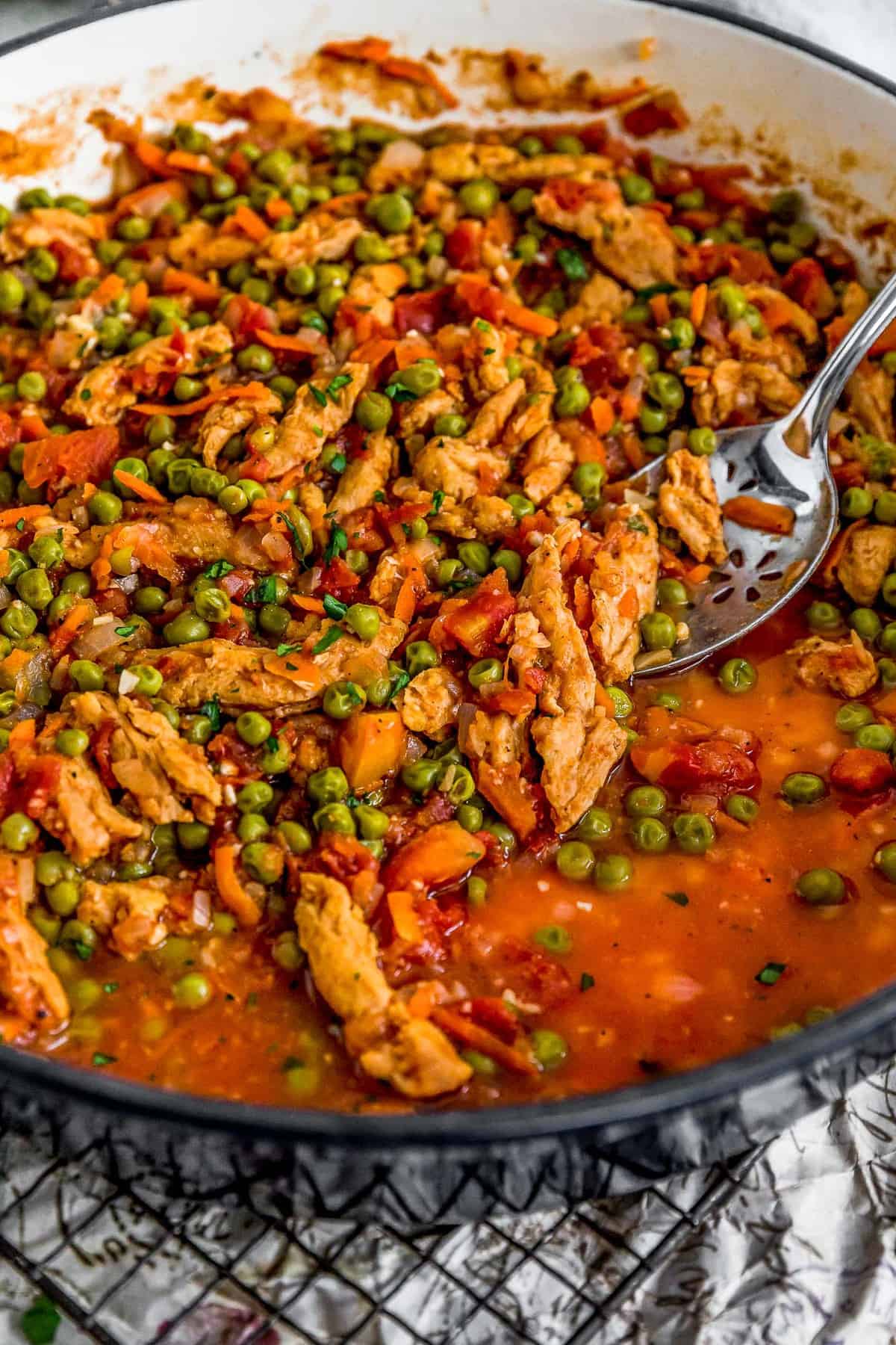 Spoon scooping Lebanese Soy Curls and Pea Stew (Bazilla)