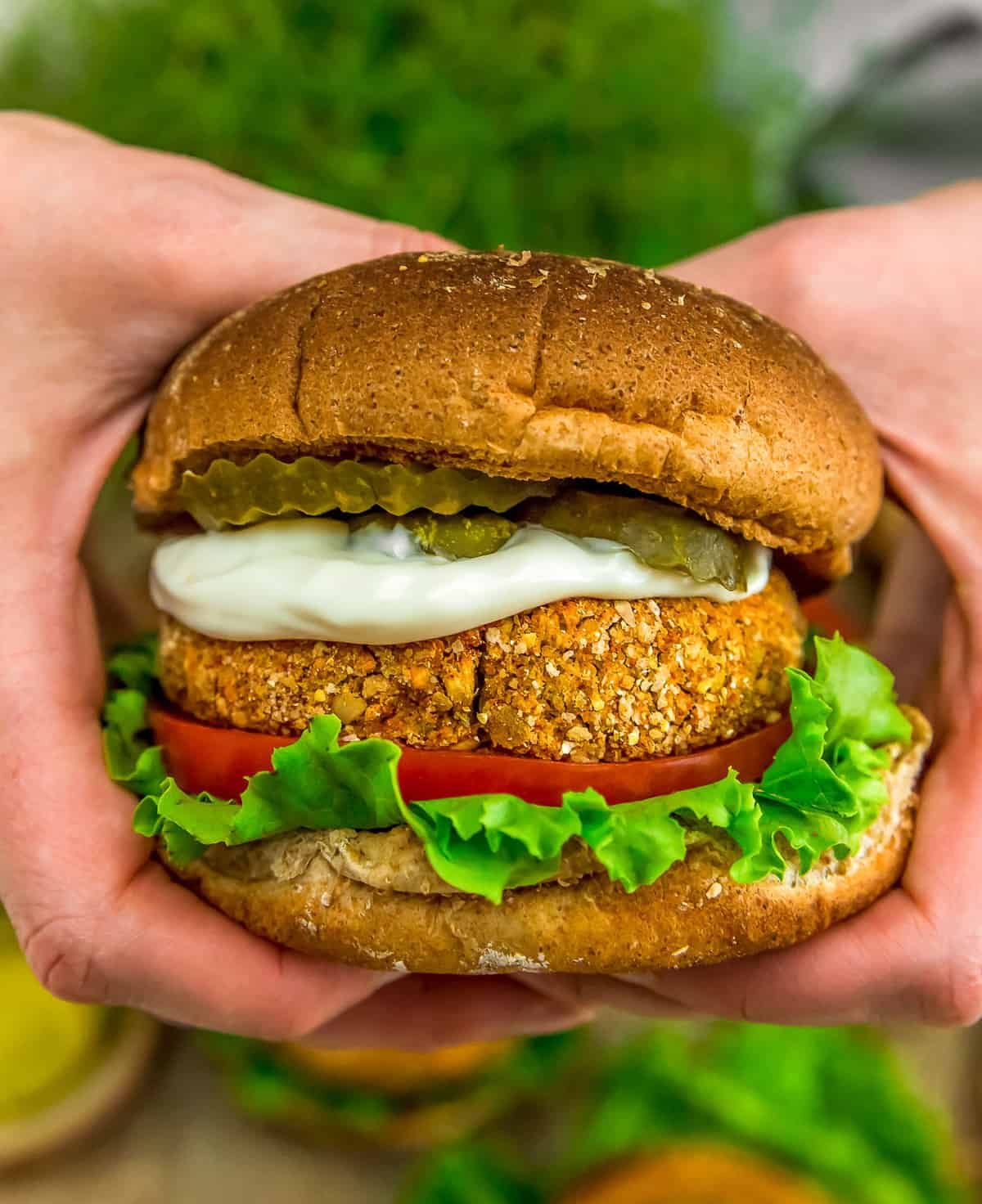 Holding a Vegan Spicy “Chicken” Patty