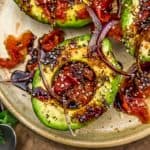 Close up of Roasted Tomato Stuffed Avocados with Balsamic Reduction