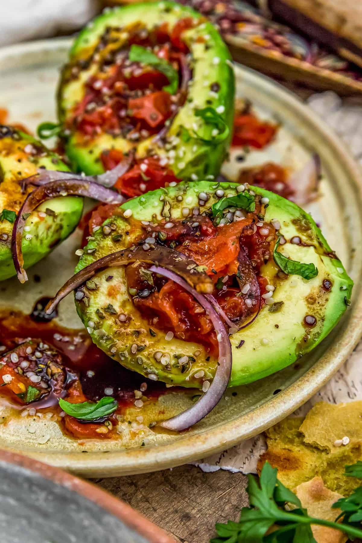Roasted Tomato Stuffed Avocados with Balsamic Reduction
