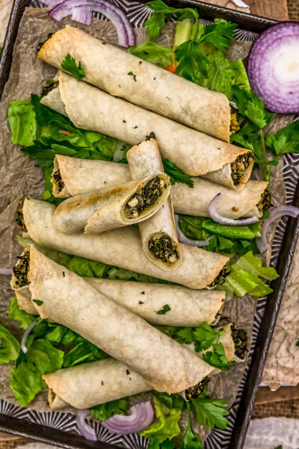 Vegan Spanakopita Rolls on a sheet tray