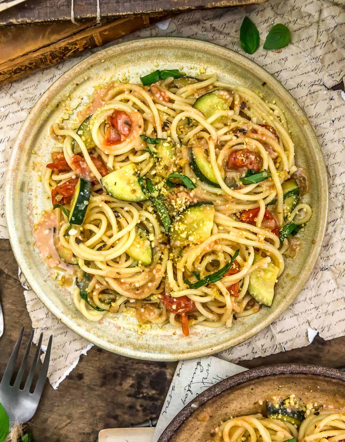 Plate of Vegan Parmesan Zucchini and Tomato Pasta