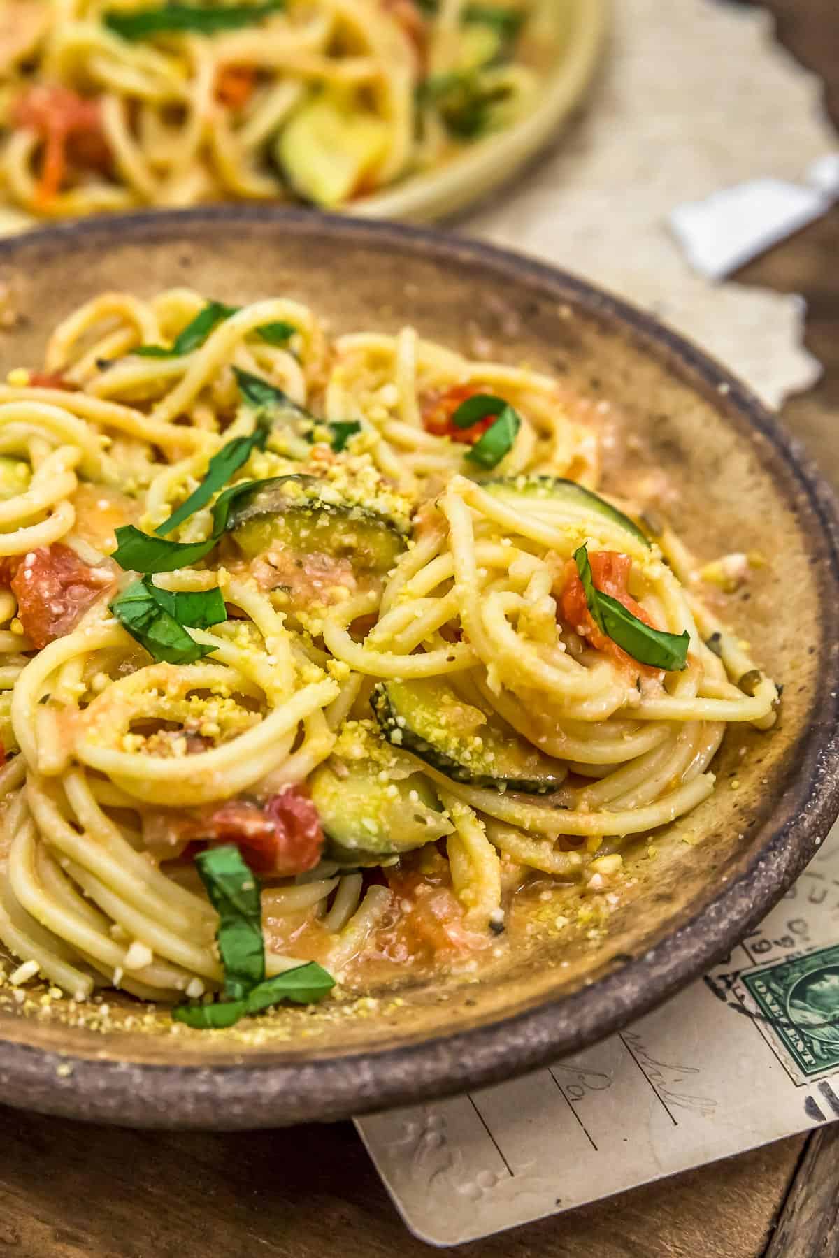 Close up of Vegan Parmesan Zucchini and Tomato Pasta
