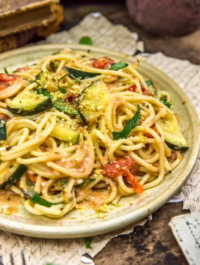 Vegan Parmesan Zucchini and Tomato Pasta on a plate