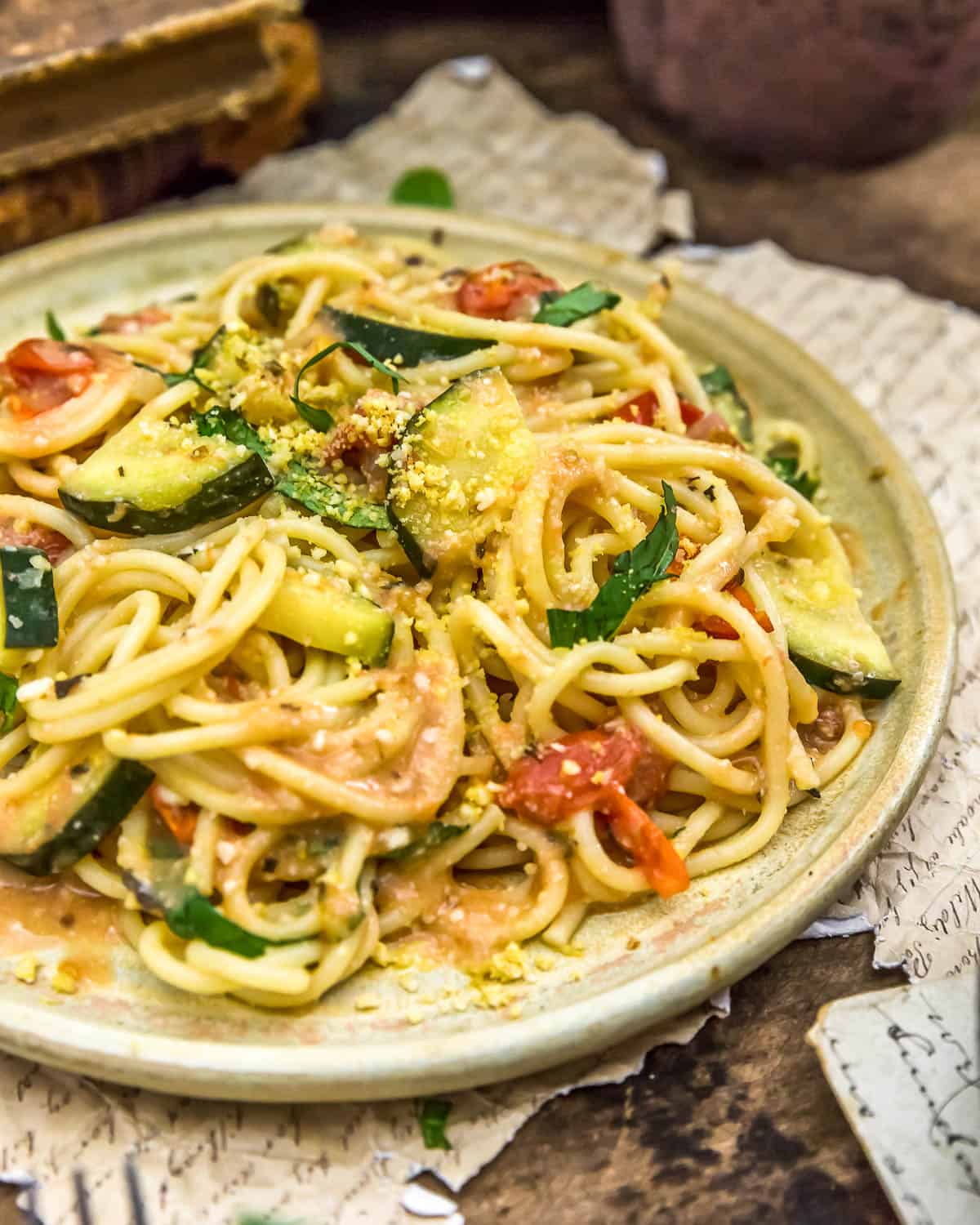 Vegan Parmesan Zucchini and Tomato Pasta on a plate