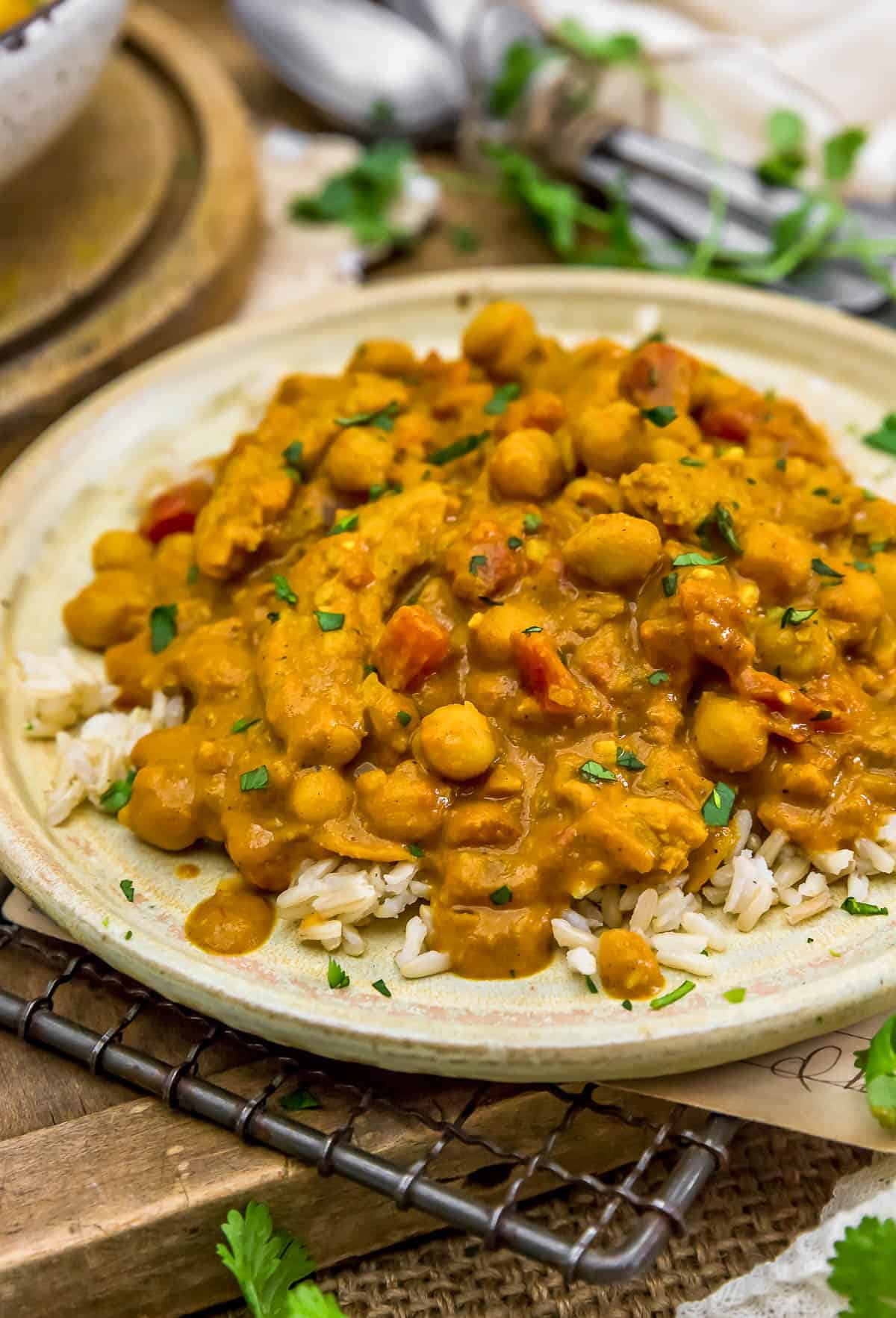 Easy Vegan Indian “Butter” Chickpeas ladled over rice