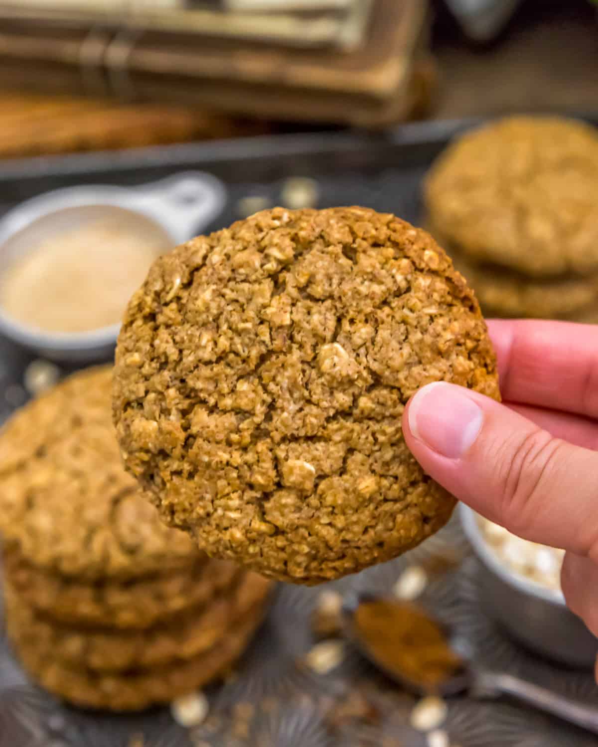 Holding an Old-Fashioned Pumpkin Spice Oatmeal Cookie