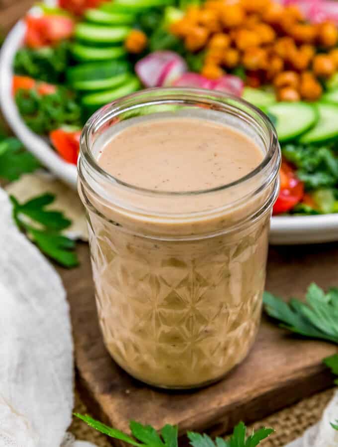Oil Free Easy Pomegranate Hummus Dressing in a jar