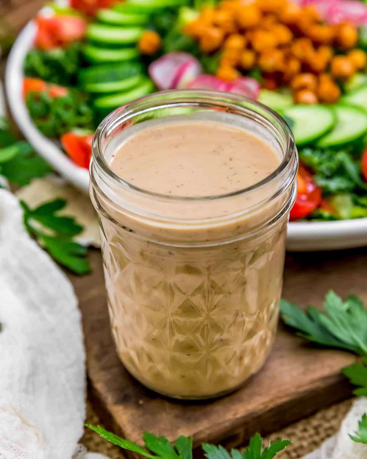 Oil Free Easy Pomegranate Hummus Dressing in a jar