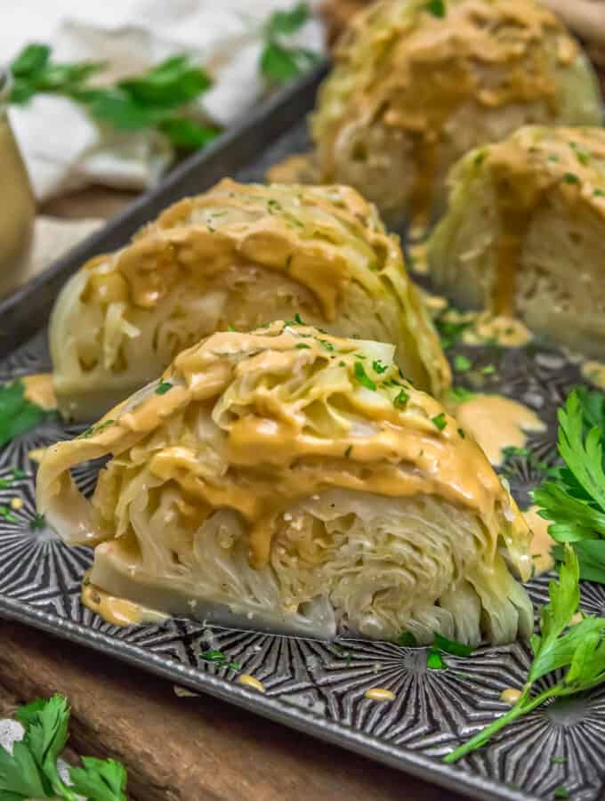 Close up of Instant Pot Cabbage Wedges with Garlic Tahini Sauce