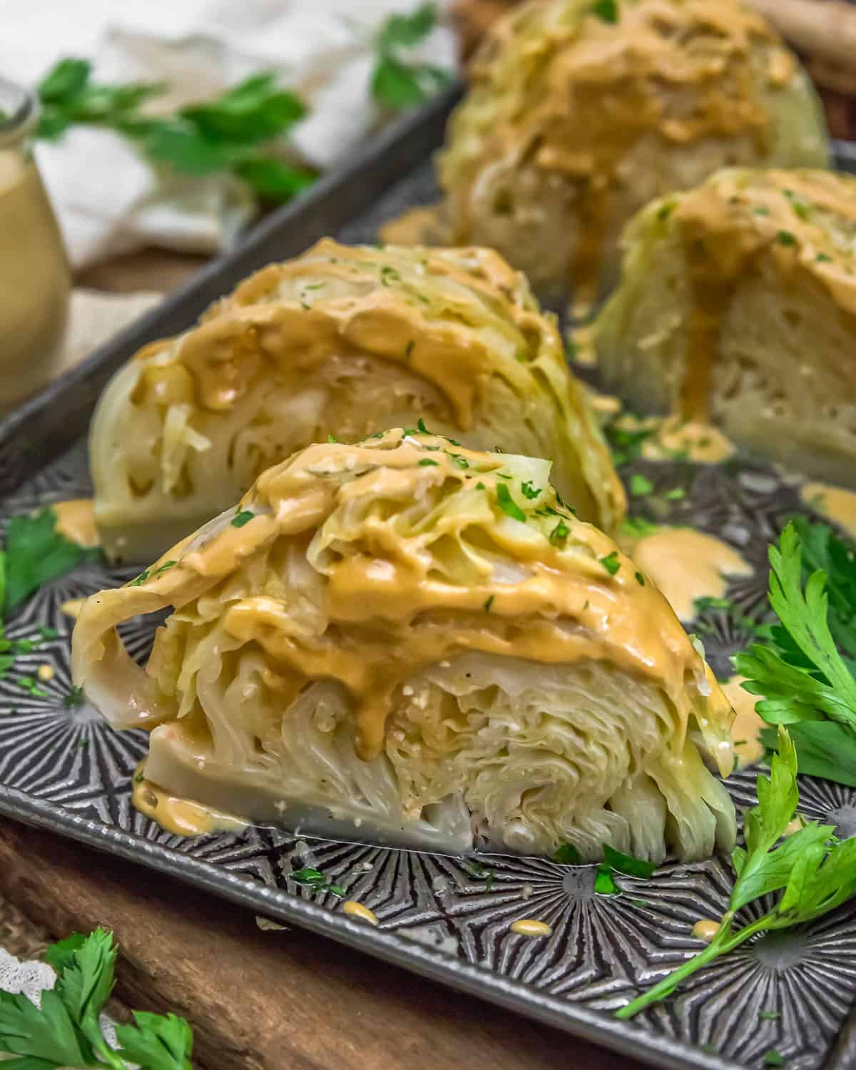 Close up of Instant Pot Cabbage Wedges with Garlic Tahini Sauce