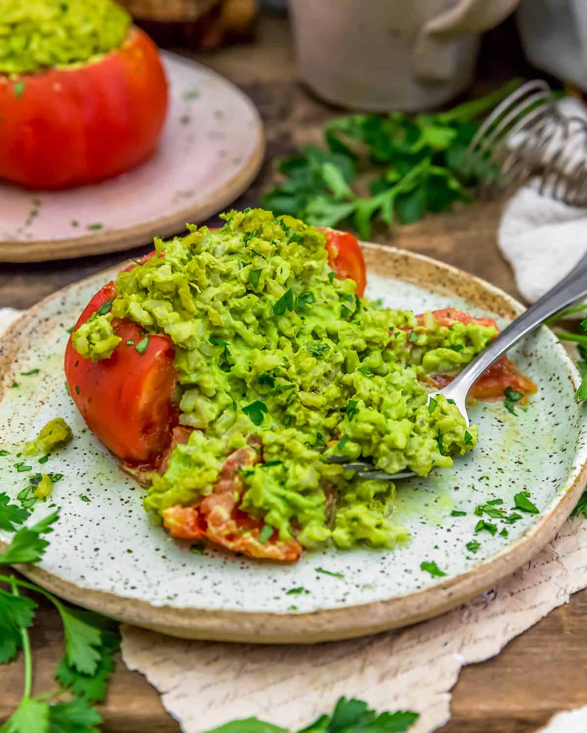 Eating an Oil Free Vegan Pesto Rice Stuffed Tomato