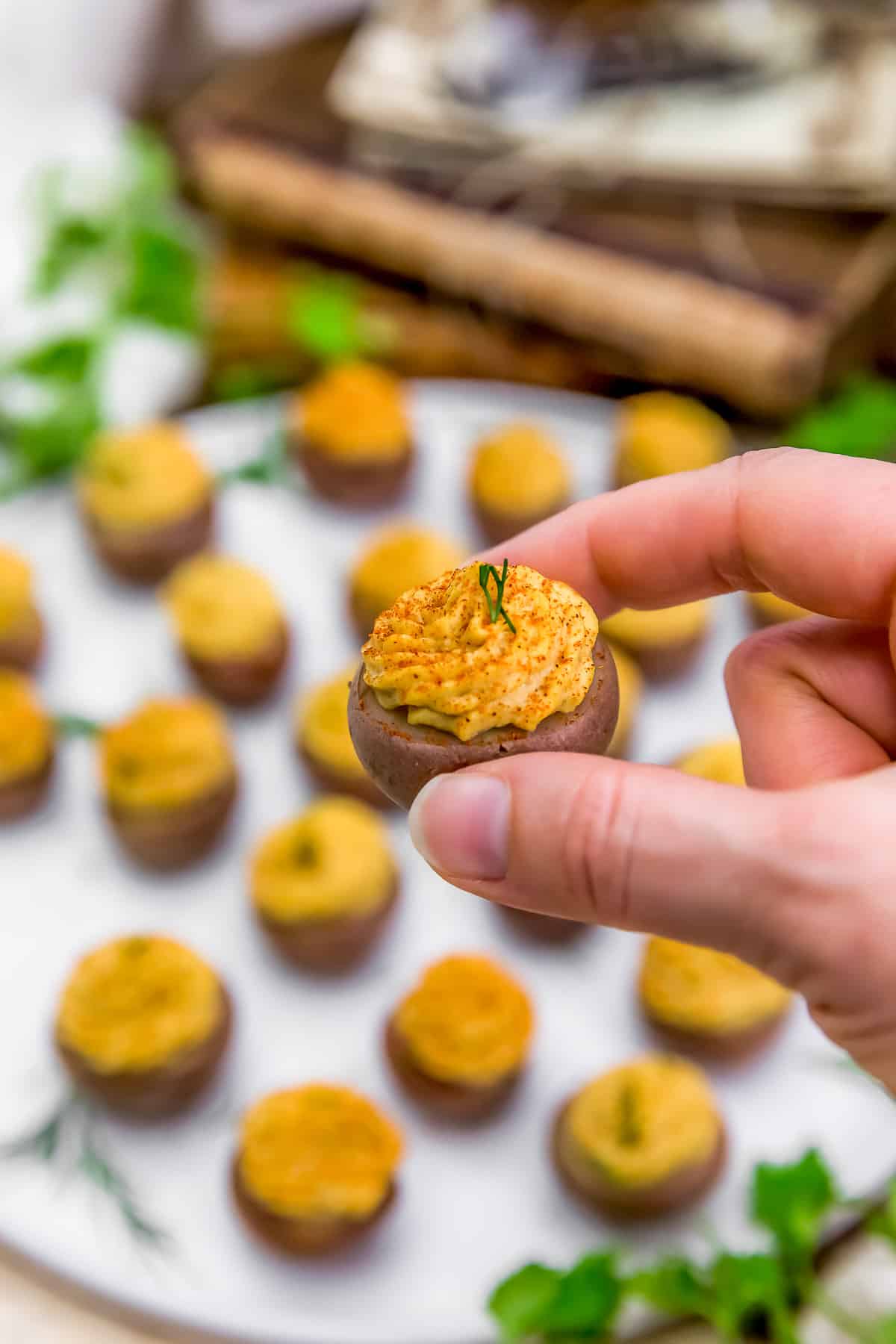 Holding a Vegan Southern Deviled Potato