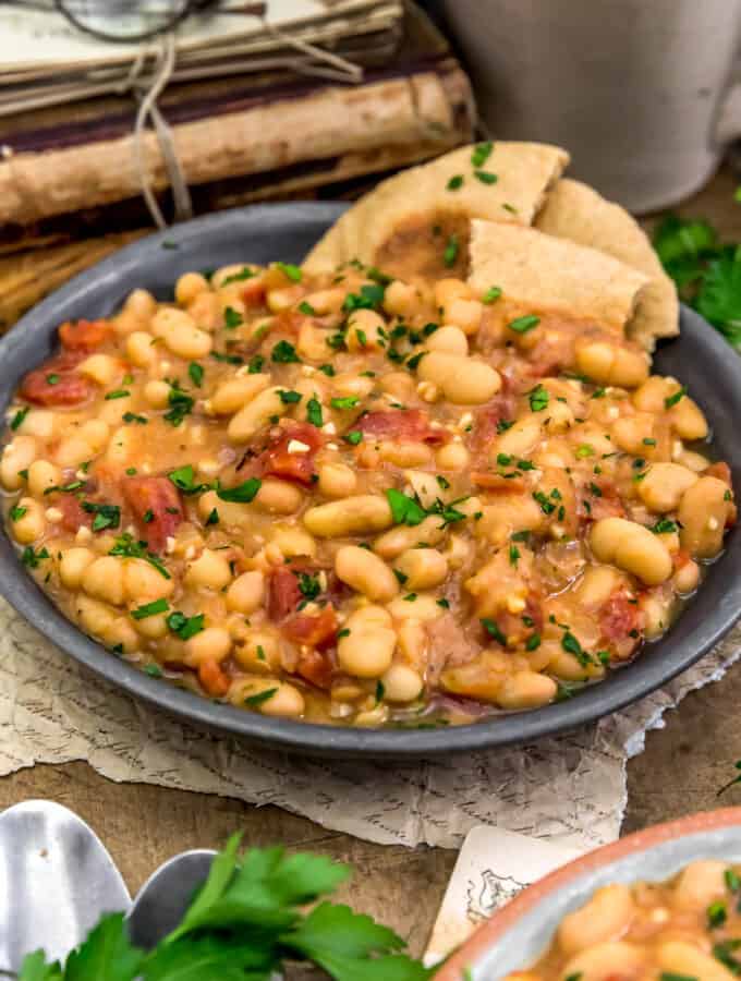 Easy Greek Brothy Beans in bowl with pita bread