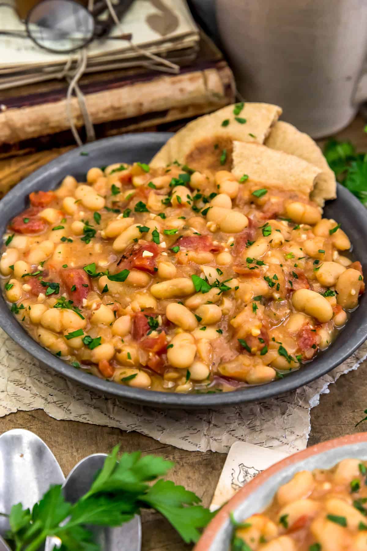 Easy Greek Brothy Beans in bowl with pita bread