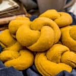 Basket of Whole Grain Pumpkin Knot Rolls