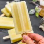 Holding a Healthy Pina Colada Popsicle