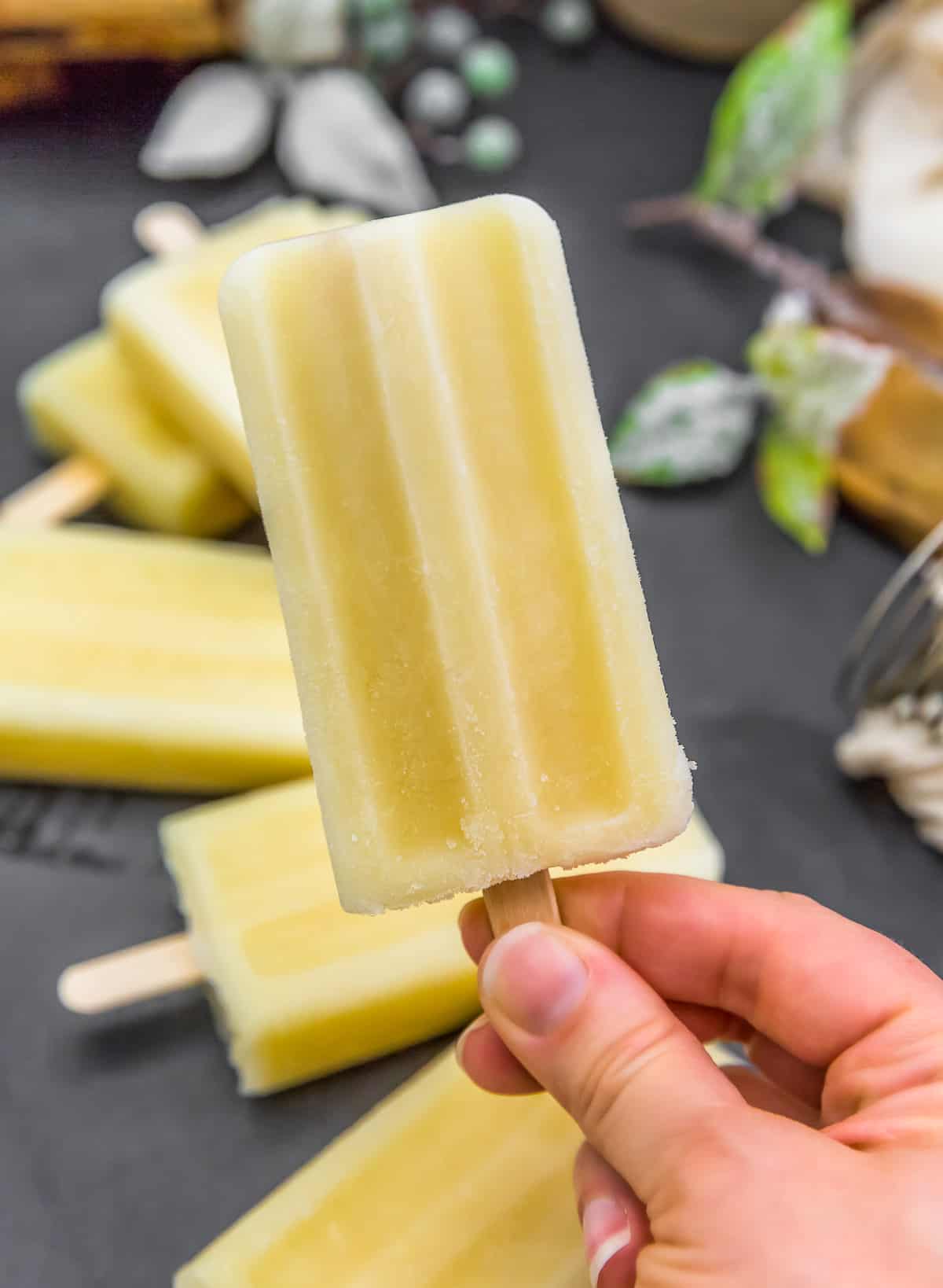 Holding a Healthy Pina Colada Popsicle