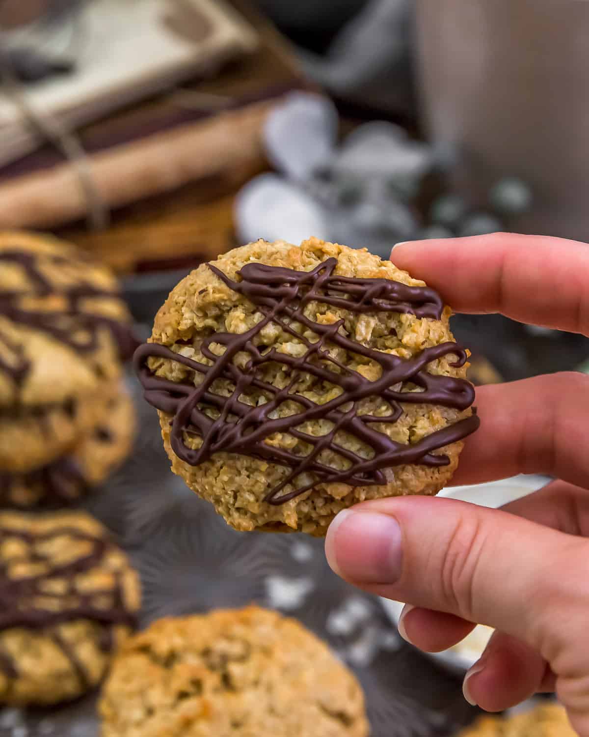 Holding a Healthy Coconut Oatmeal Cookie