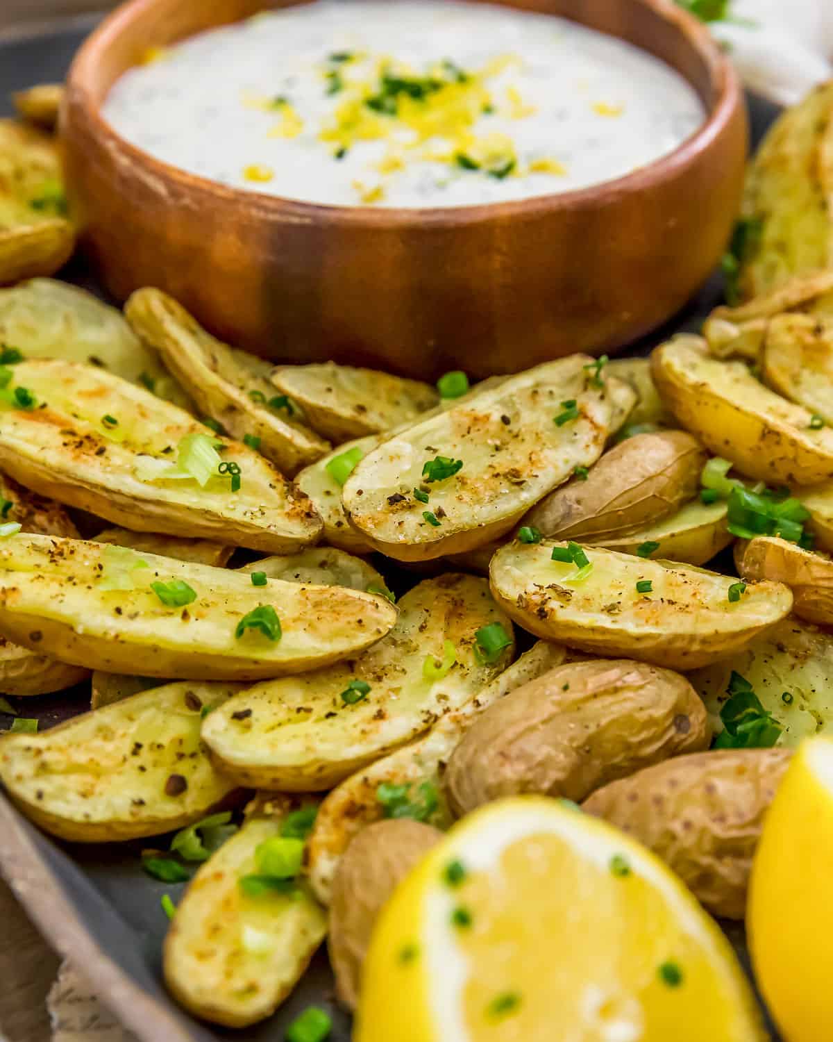 Close up of Herb Roasted Potatoes with Vegan Lemon Chive Sauce