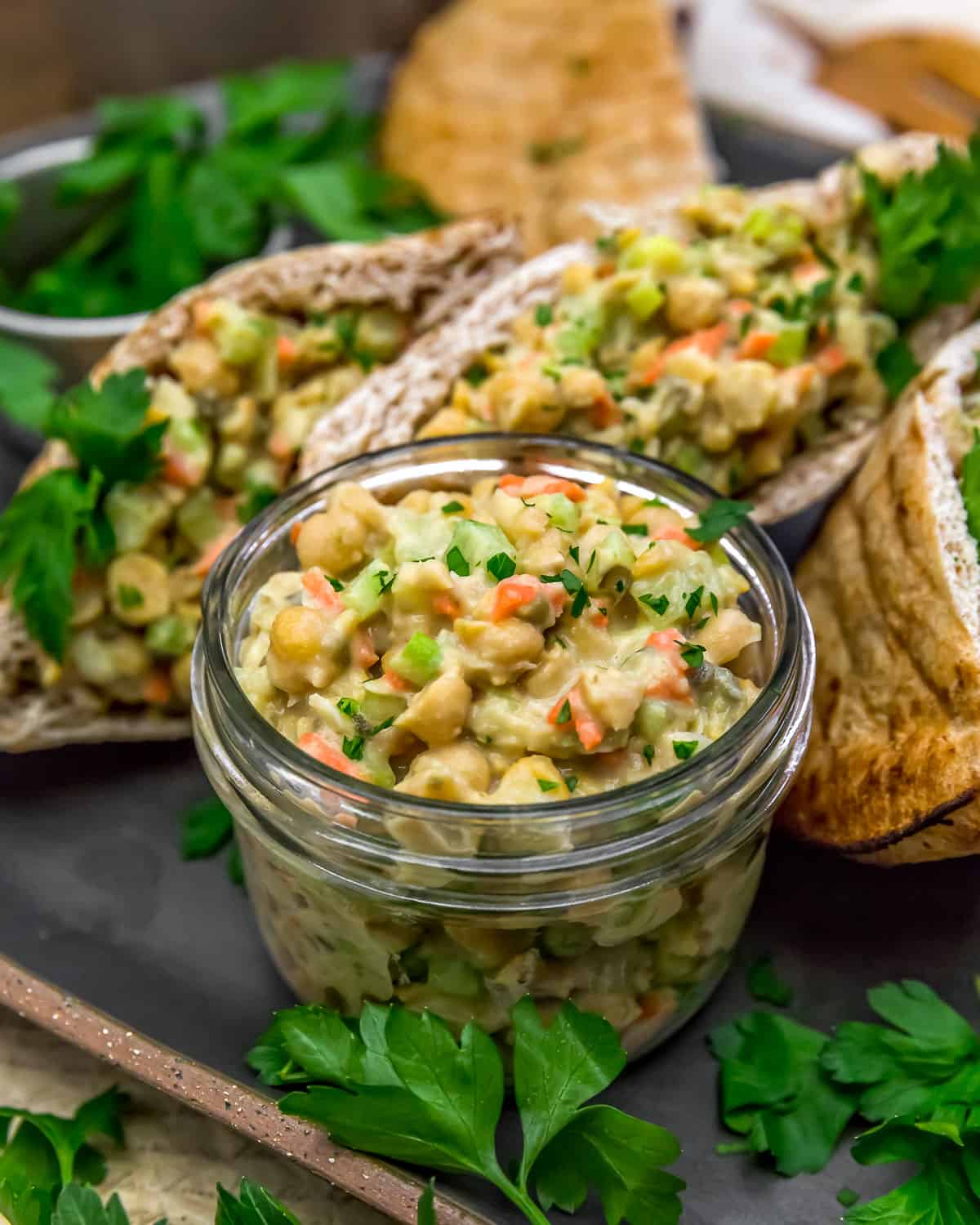 Easy Vegan Caesar Chickpea Salad in a jar with stuffed pitas
