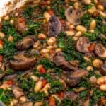 Close up of Mushrooms Beans and Kale in Red Wine Sauce