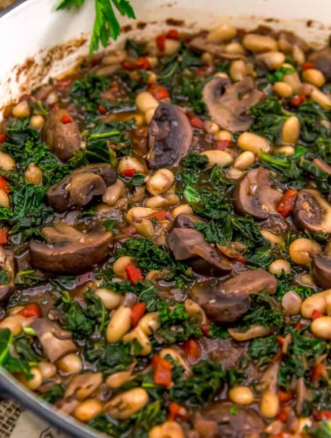 Close up of Mushrooms Beans and Kale in Red Wine Sauce