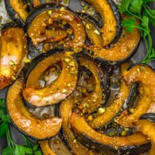 Roasted Acorn Squash with Maple Sauce and Pistachios - Monkey and
