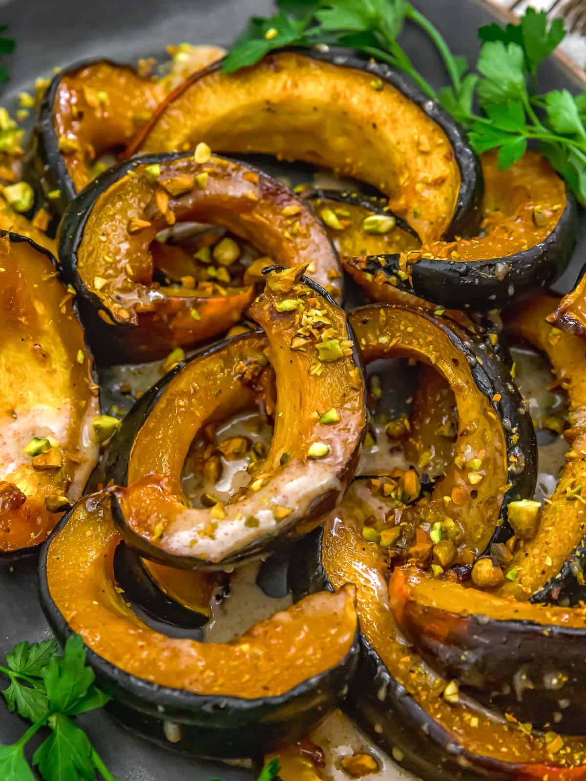 Close up of Roasted Acorn Squash with Maple Sauce and Pistachios