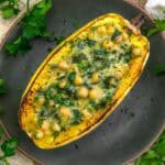 Plate of Low-Fat Stuffed Spaghetti Squash with Creamy Garlic Chickpea Spinach Sauce