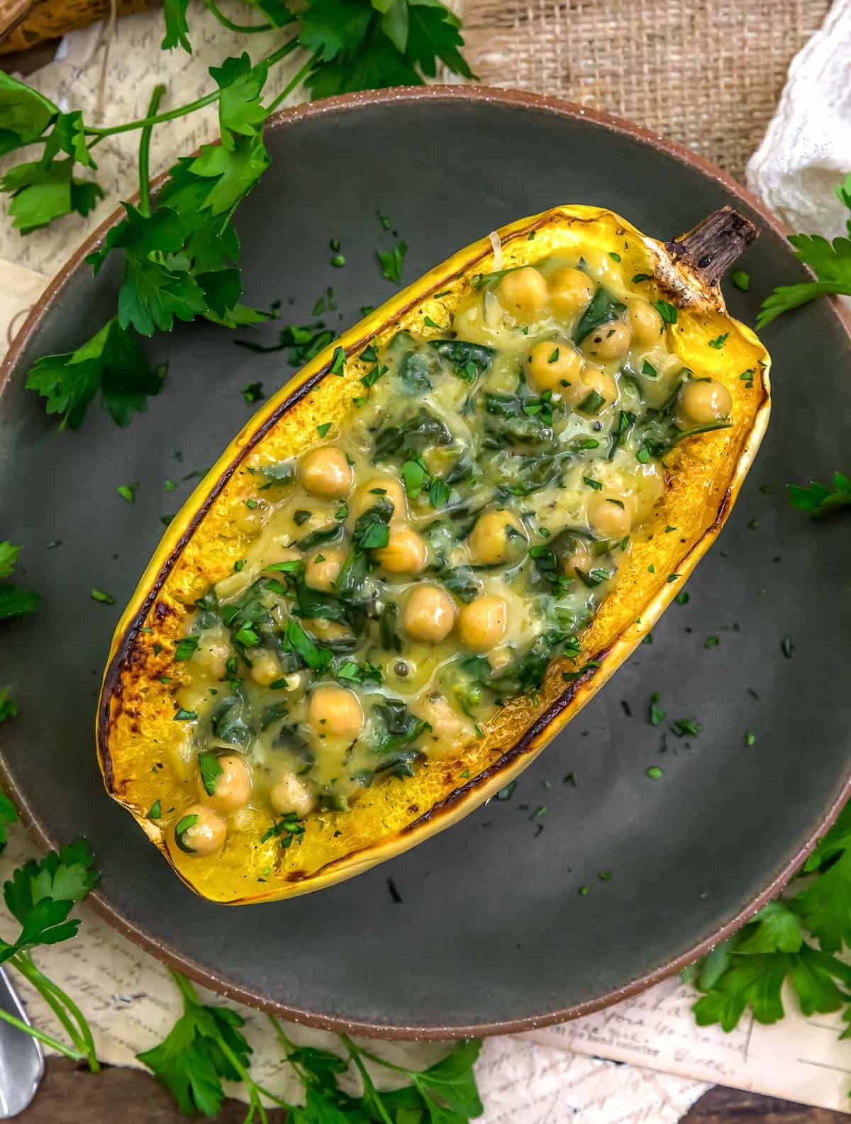 Plate of Low-Fat Stuffed Spaghetti Squash with Creamy Garlic Chickpea Spinach Sauce
