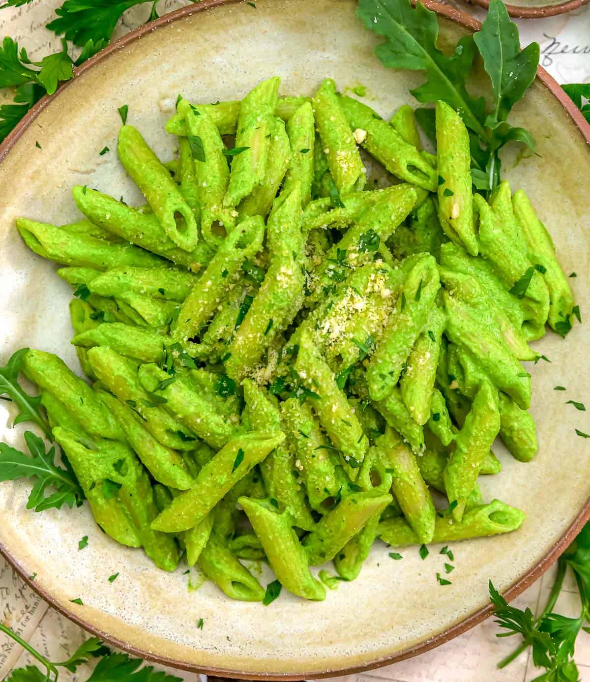 Bowl of Vegan Arugula Pesto Parmesan Pasta