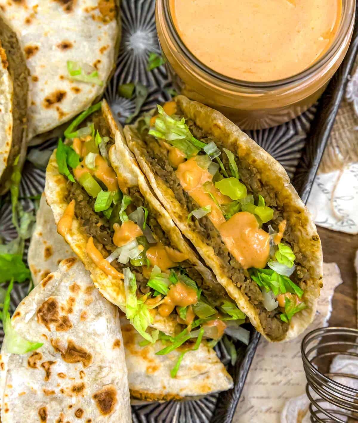 Close up of Big Mac Smashed Lentil Tacos with toppings