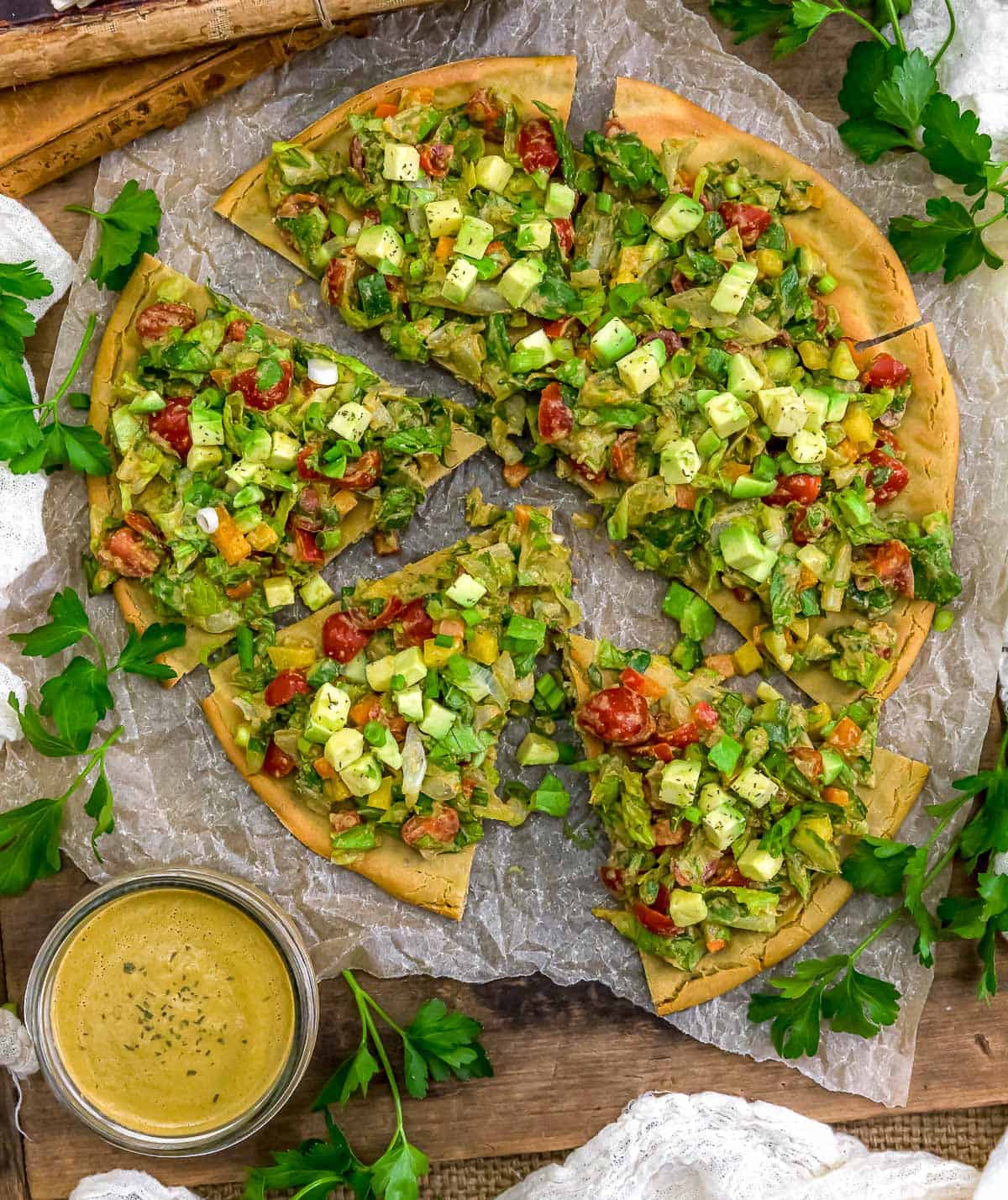 Garden Salad Flatbread Pizza with side of sauce