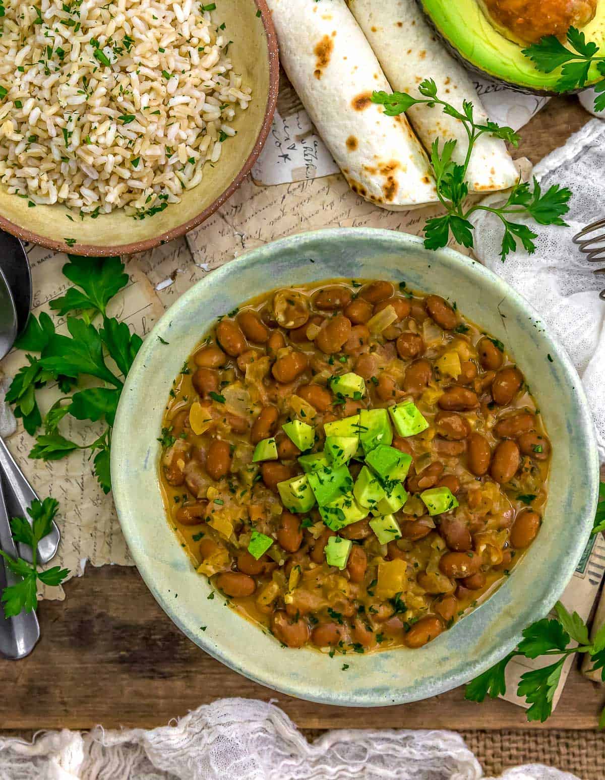 Vegan Cheesy Pinto Beans with rice and tortillas