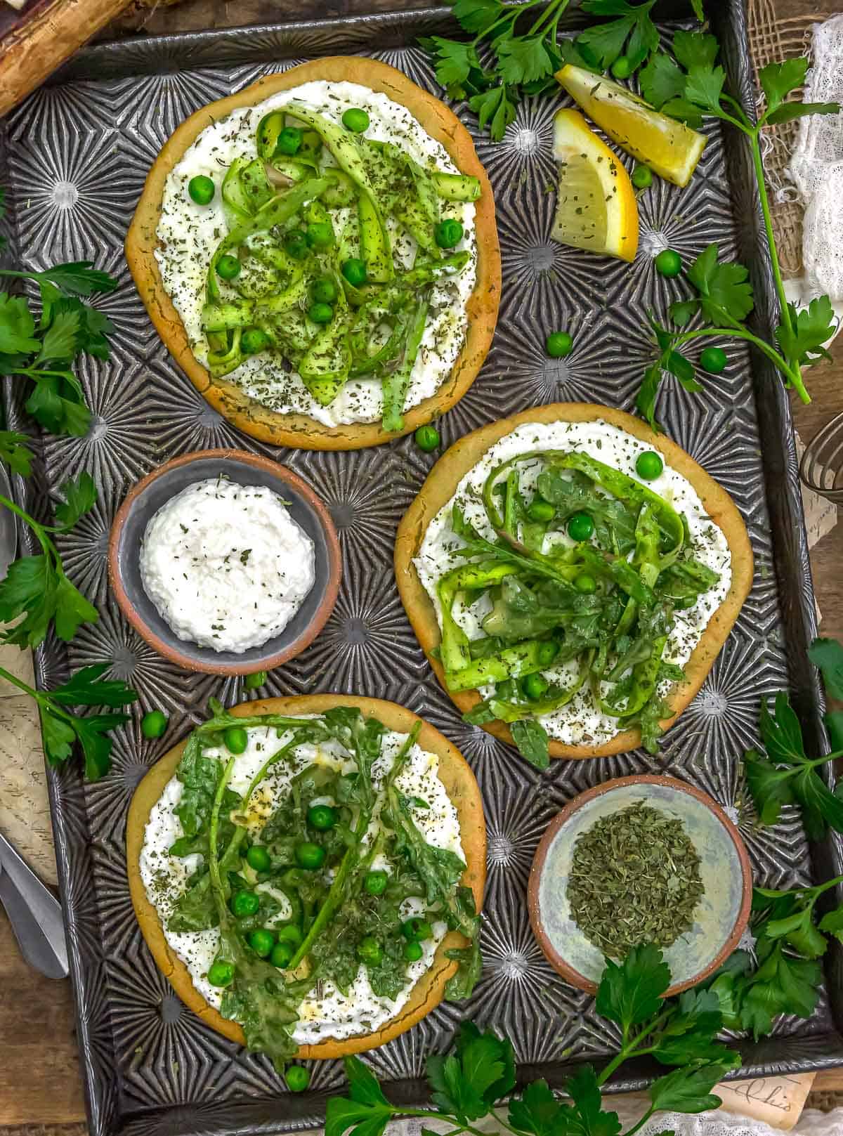 Baking sheet of Vegan Asparagus Ricotta Flatbread Pizza